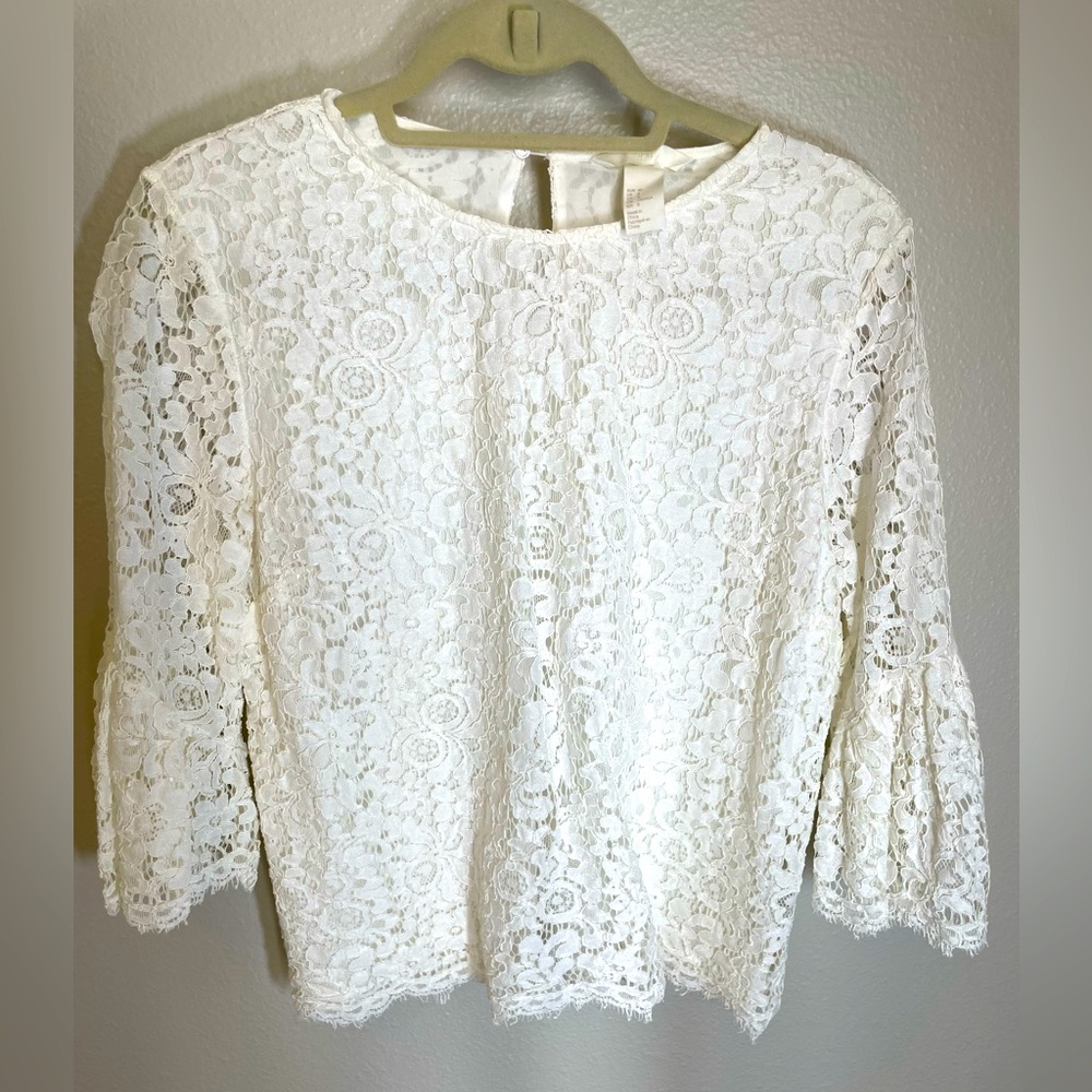 White floral lace blouse with tufted sleeves
